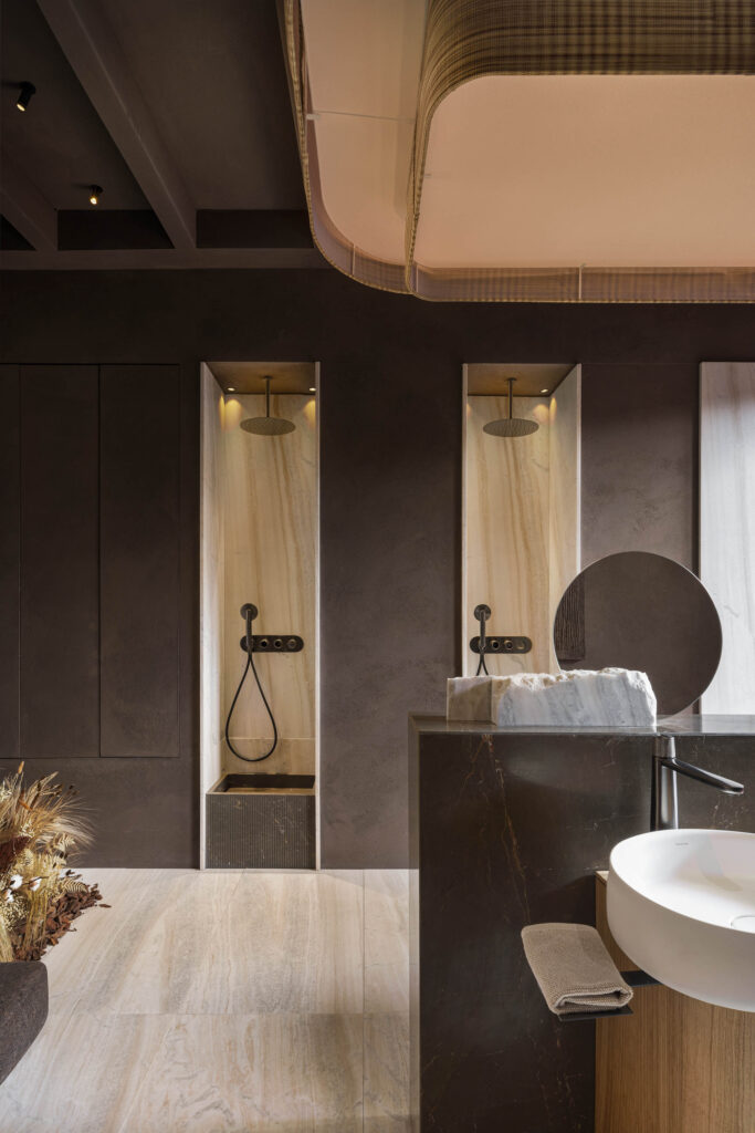 Palissandro marble cladding and an Armany Brown washbasin
